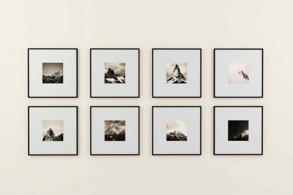 gallery wall of matching, symmetrical framed photos