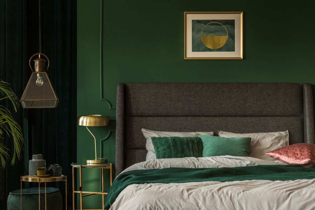 yellow-green walls behind bed - dark green is one of the best bedroom paint colors for dark furniture