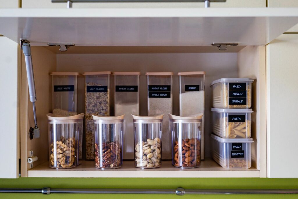 dry pantry goods in clear storage containers with labels