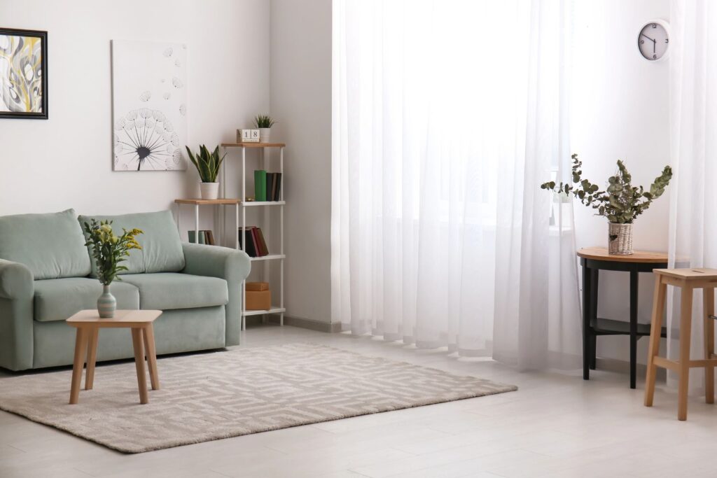 living room with sheer curtains